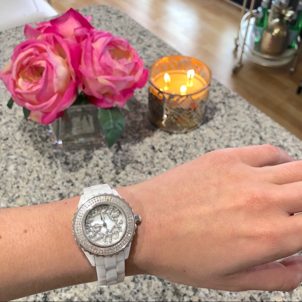 White ceramic watch with diamonds.